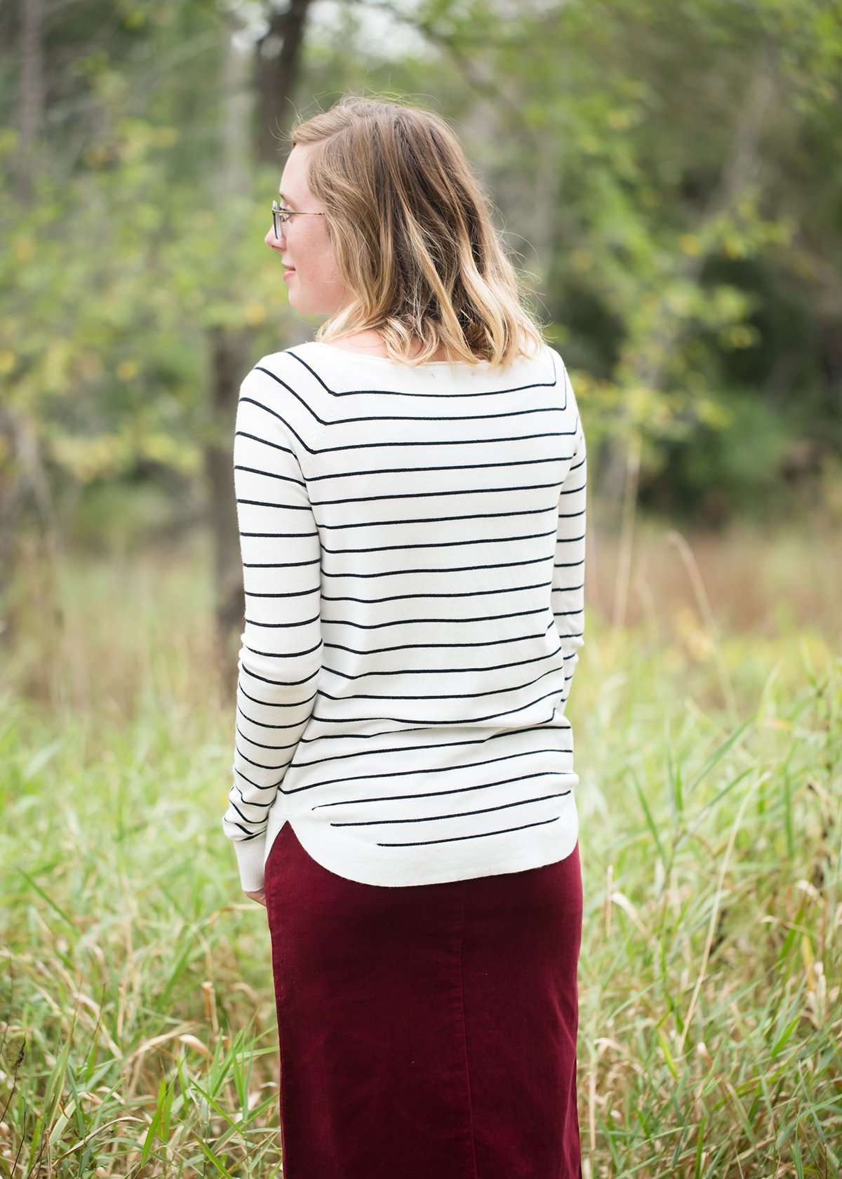 Ivory with thin black striped boatneck long-sleeve shirt.