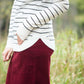 Ivory with thin black striped boatneck long-sleeve shirt.