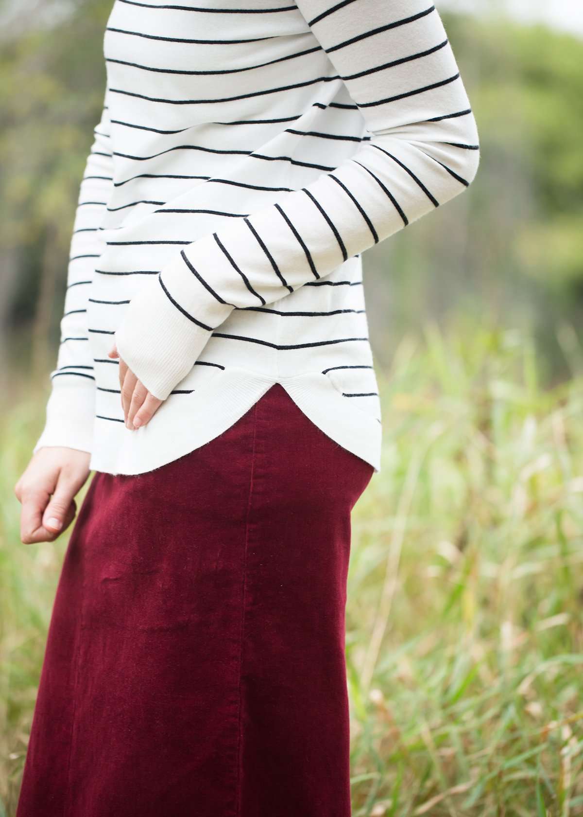Ivory with thin black striped boatneck long-sleeve shirt.