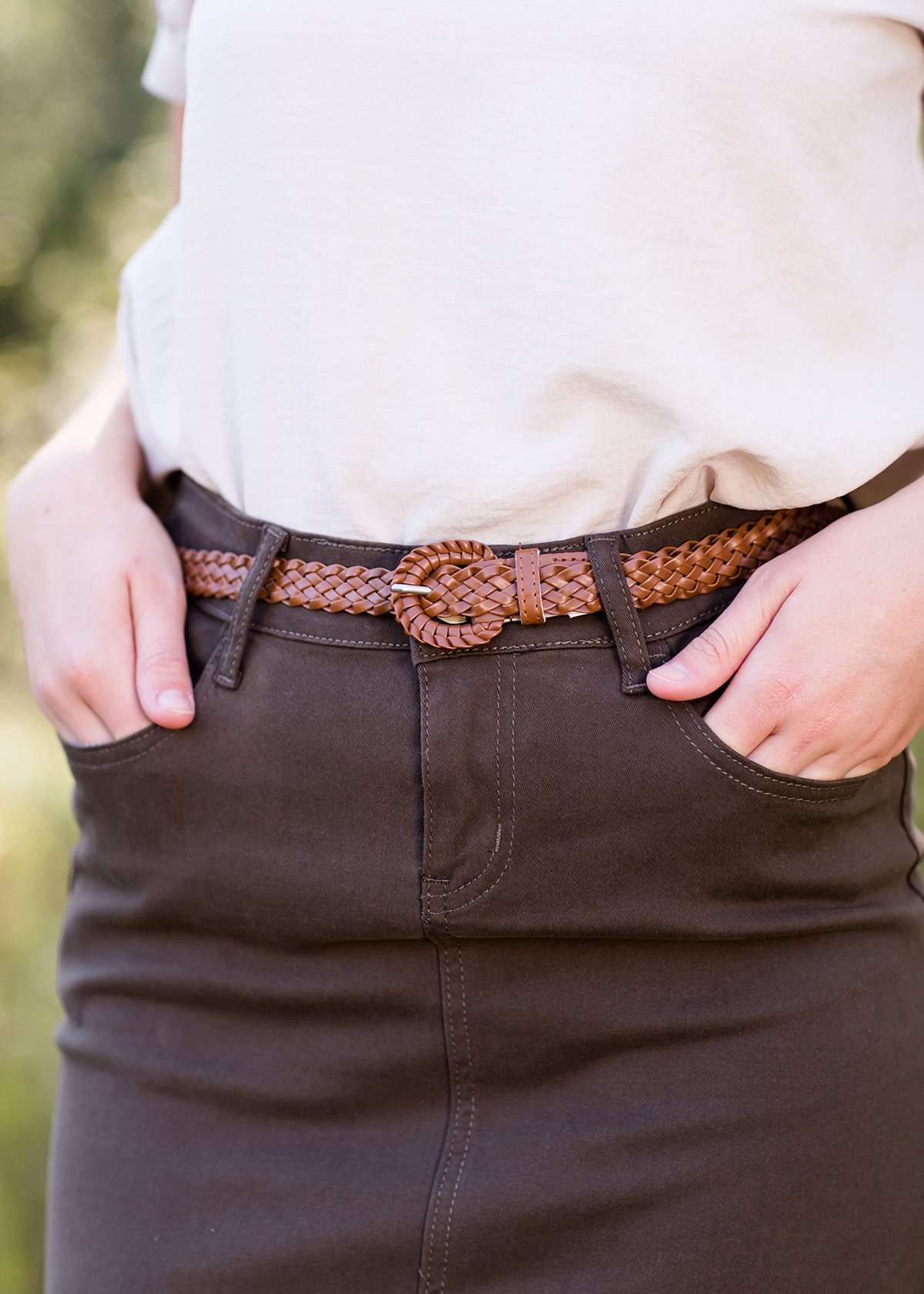 A 43 inch long, 100% leather brown braided belt.
