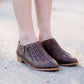 Women's braided ankle bootie in black or brown. These have a stacked heel and feature a size zipper closure.