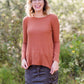 Brick in color, lightweight waffle knit long sleeve top.
