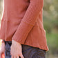 Brick in color, lightweight waffle knit long sleeve top.