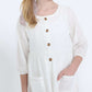 modest girls white peasant dress with pockets and buttons