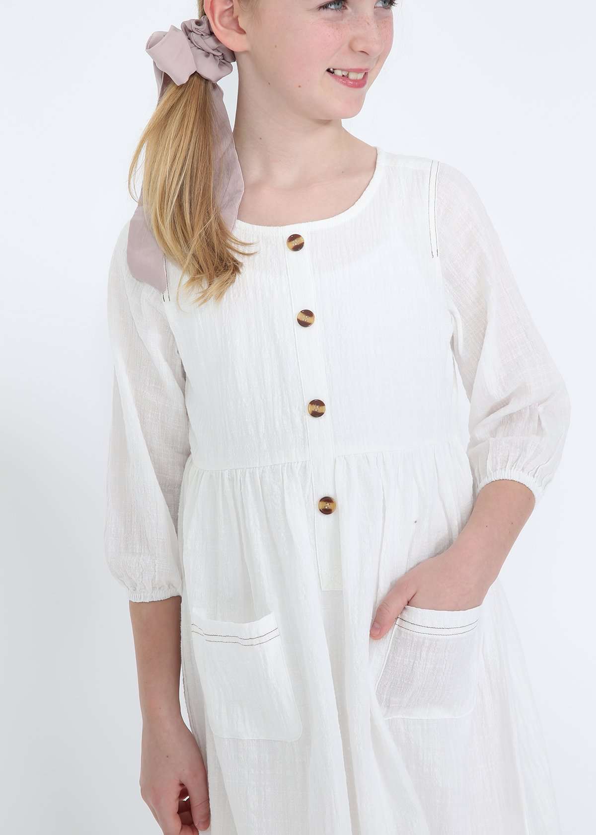 modest girls white peasant dress with pockets and buttons