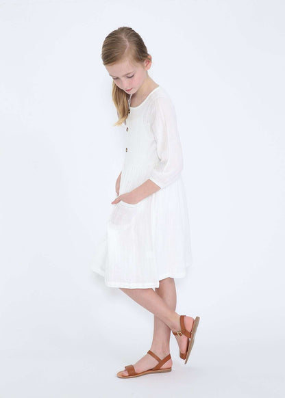 modest girls white peasant dress with pockets and buttons