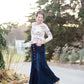 Woman wearing a long denim skirt without a slit that has buttons up the front and is a flare, a-line style.