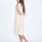 Modest women's cream cotton dress with brown buttons and half sleeves
