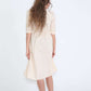 Modest women's cream cotton dress with brown buttons and half sleeves