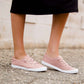 Blush or grey option mesh slip on, laced up shoe. Either color has a white sole.