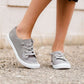 Blush or grey option mesh slip on, laced up shoe. Either color has a white sole.