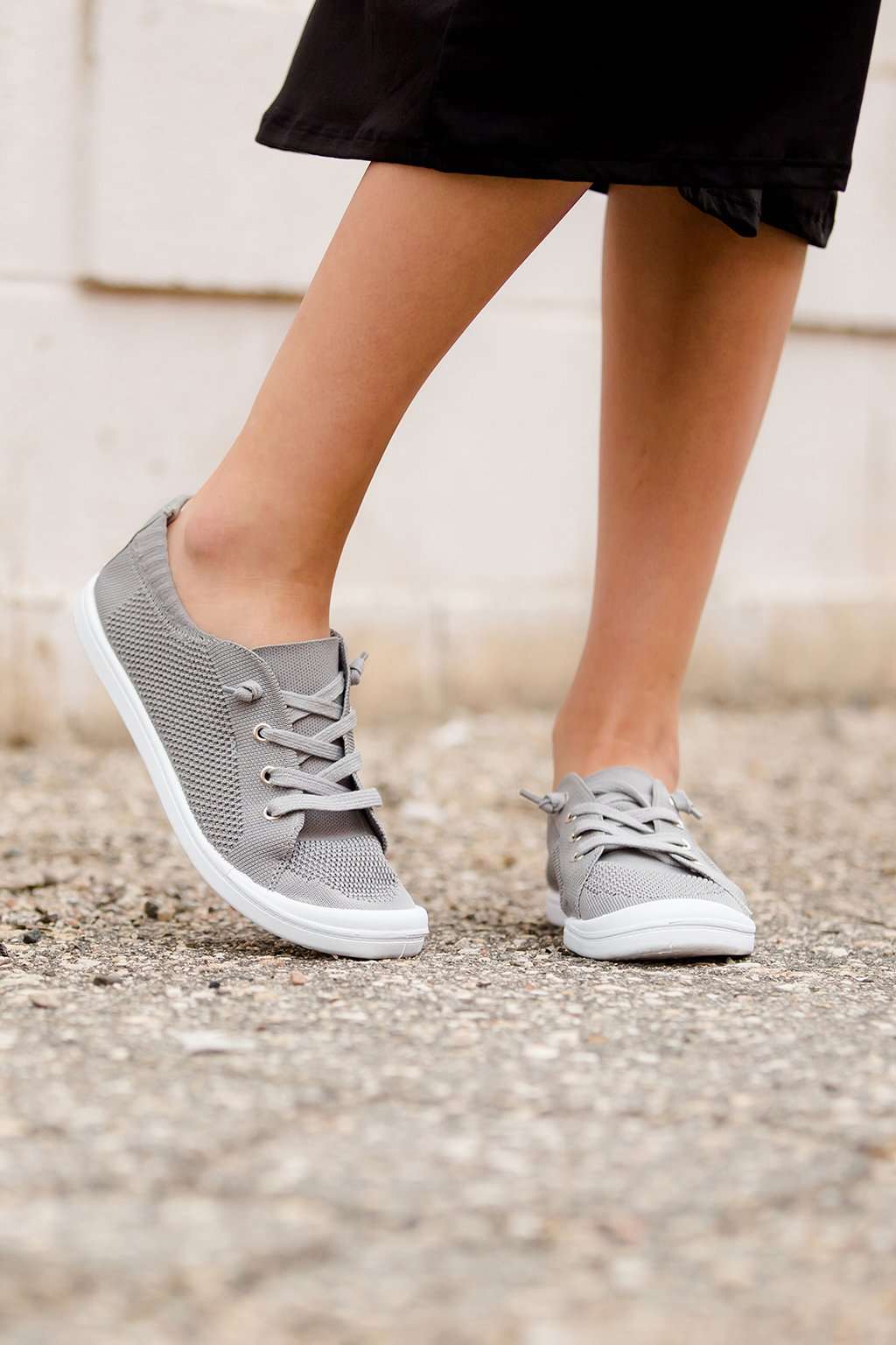 Blush or grey option mesh slip on, laced up shoe. Either color has a white sole.