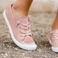 Blush or grey option mesh slip on, laced up shoe. Either color has a white sole.
