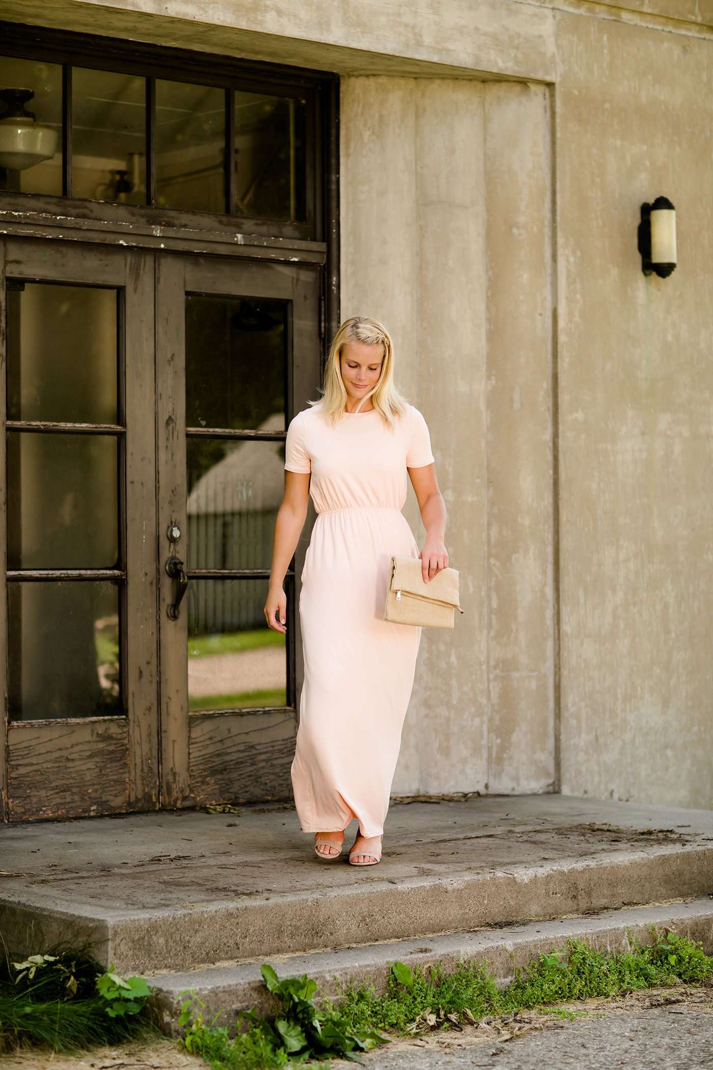 Modest women's maxi dress in peach, navy or black. 2 hidden side seam pockets, elastic waist and short sleeves.