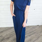 Modest women's maxi dress in peach, navy or black. 2 hidden side seam pockets, elastic waist and short sleeves.