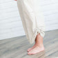 Black, tan or olive option in this long skirt with drawstring waist and side strings to adjust height from midi to maxi