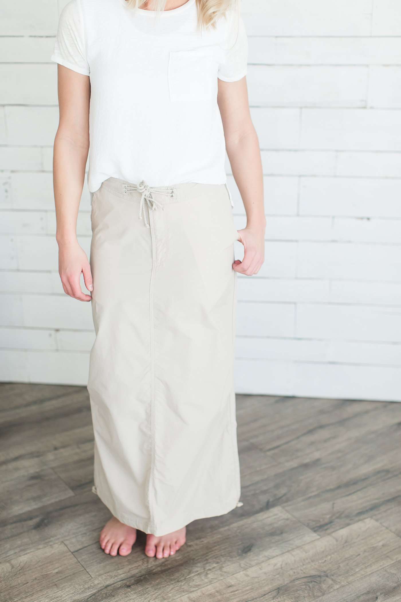 Black, tan or olive option in this long skirt with drawstring waist and side strings to adjust height from midi to maxi