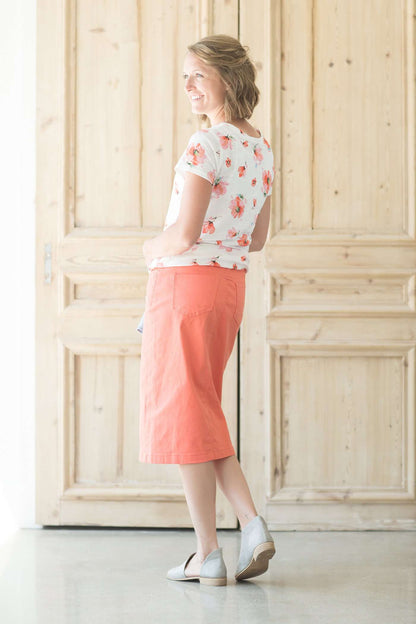 Coral midi skirt with front and back pockets and no slit.