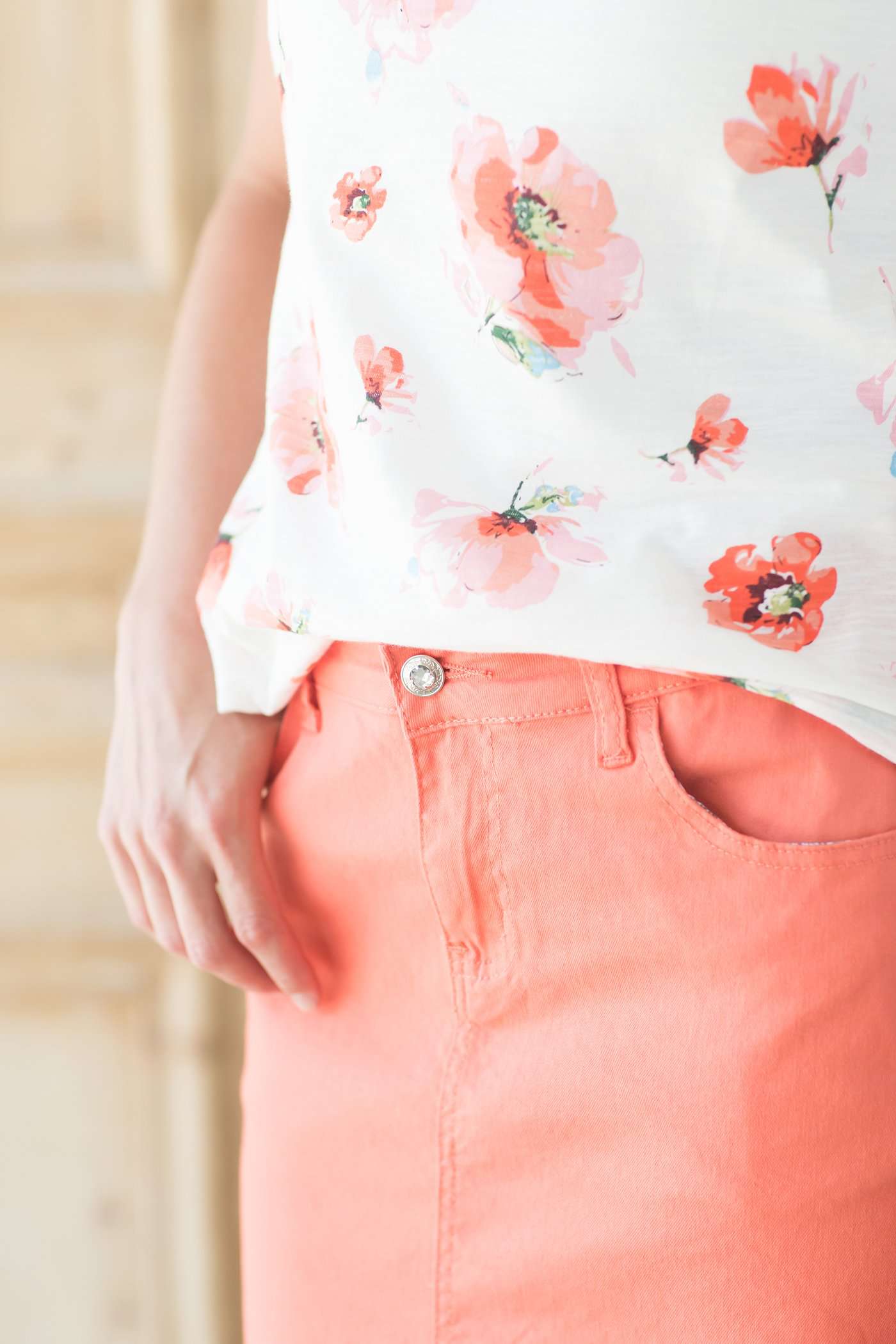 Coral midi skirt with front and back pockets and no slit.