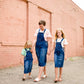 woman in a modest denim overall jumper dress