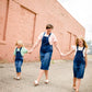 woman in a modest denim overall jumper dress