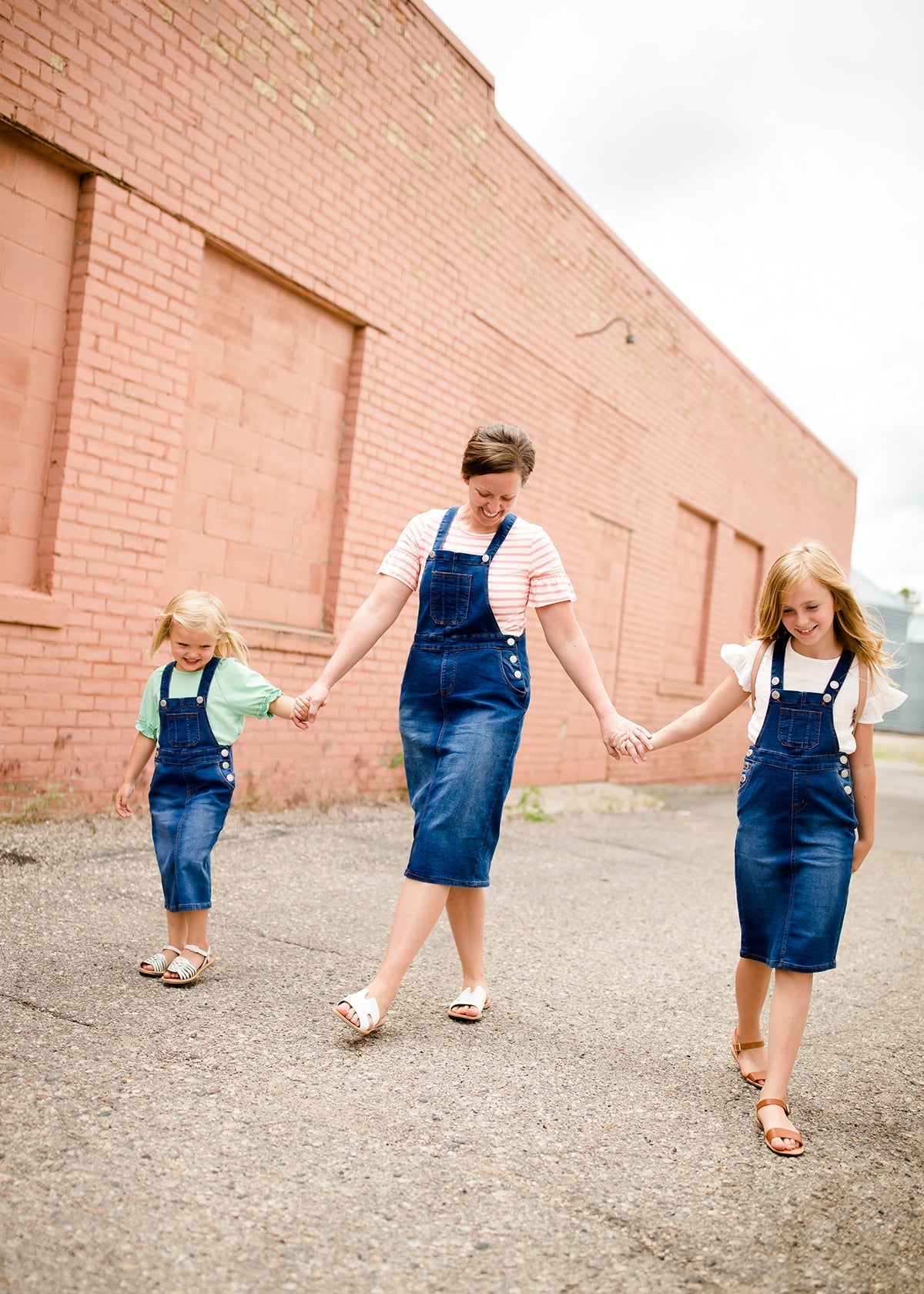 woman in a modest denim overall jumper dress