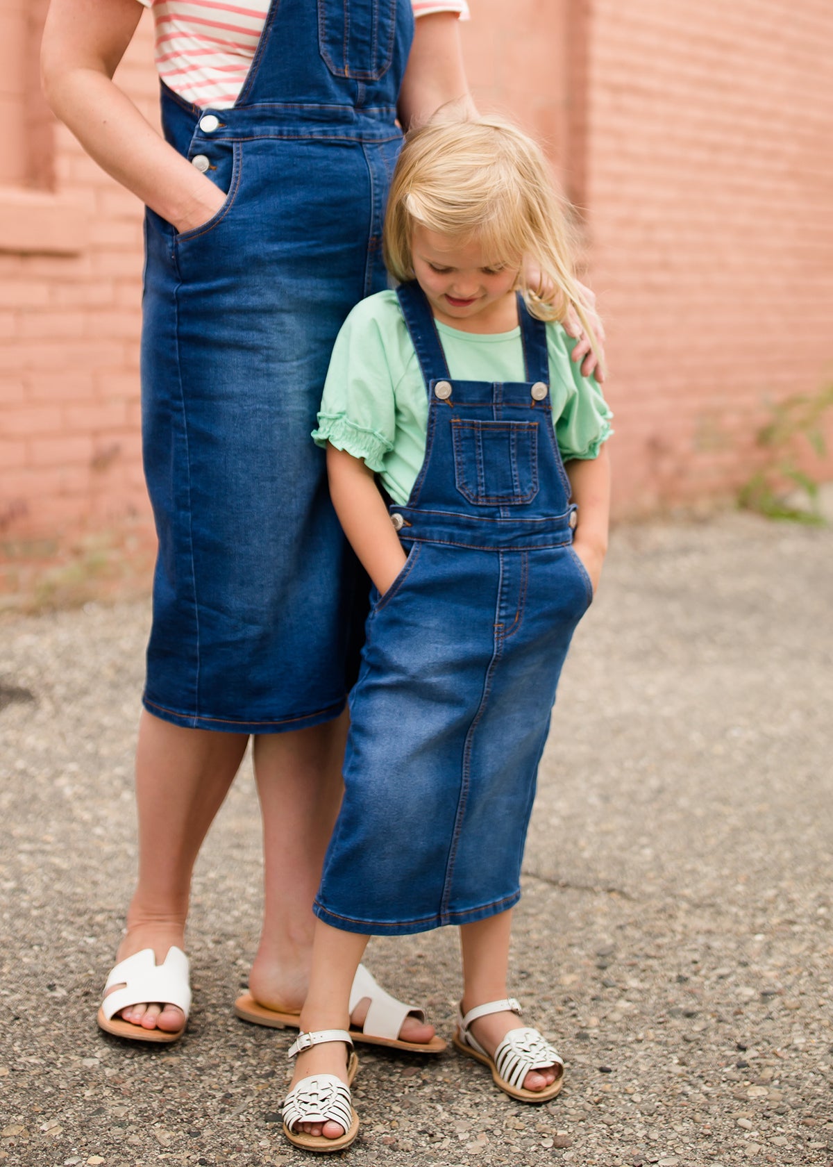 woman in a modest denim overall jumper dress