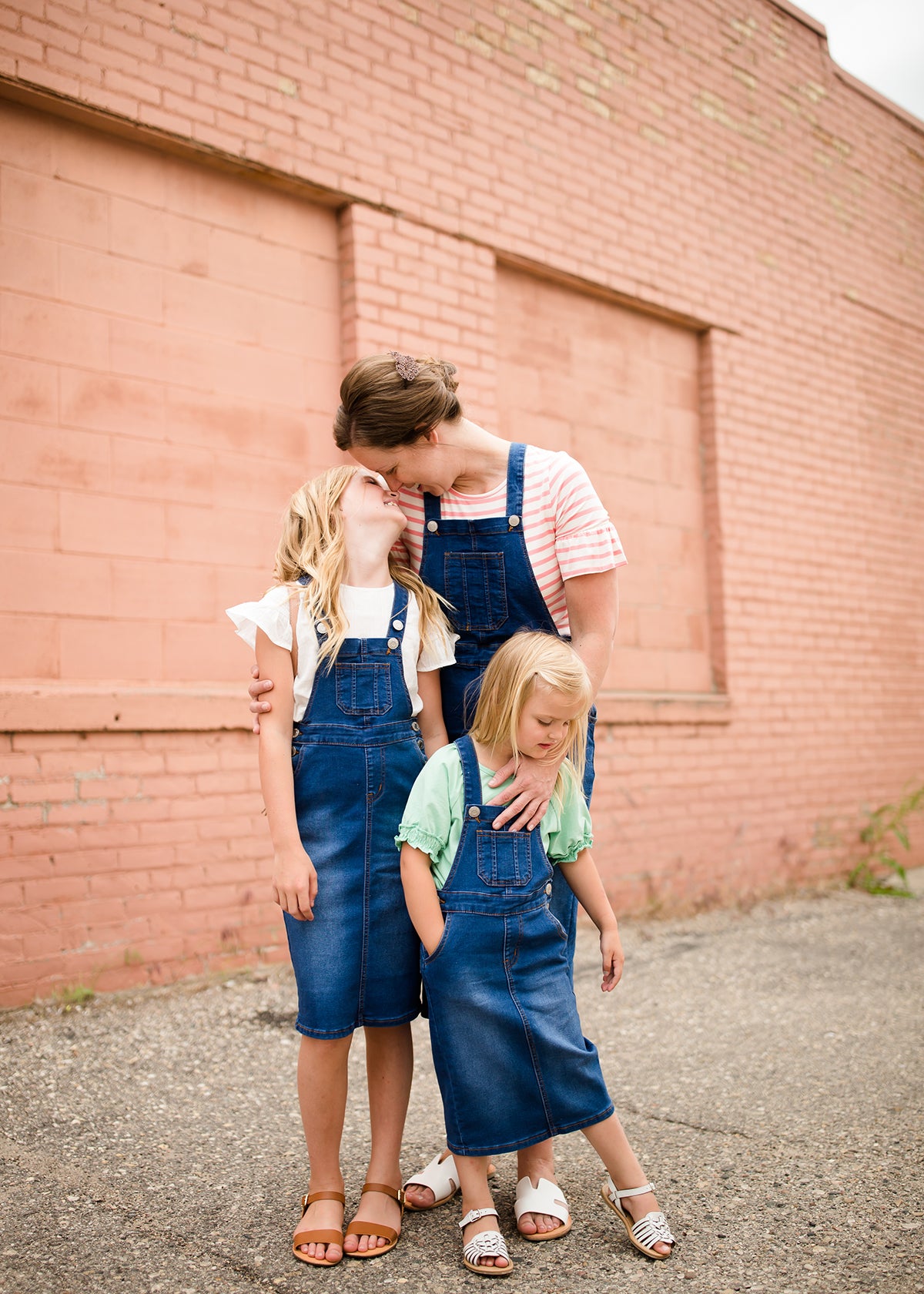 woman in a modest denim overall jumper dress