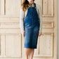 woman in a modest denim overall jumper dress