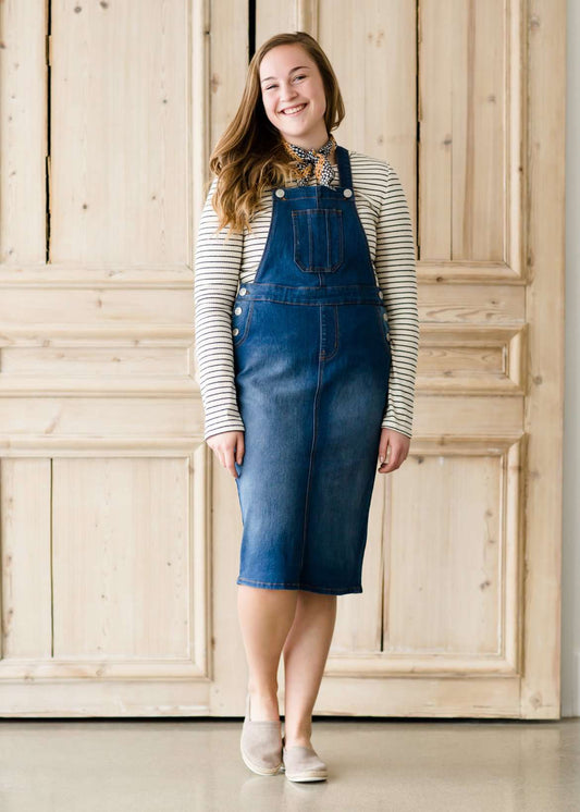 woman in a modest denim overall jumper dress
