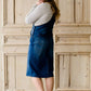 woman in a modest denim overall jumper dress