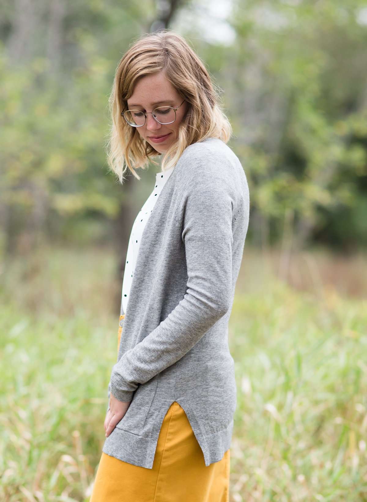 Knit cardigan, in black, heather gray, oatmeal or mauve option. Long sleeves, front pockets and open front.