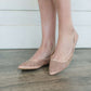 Blush or taupe casually detailed and patterned flat shoe with pointed toe.