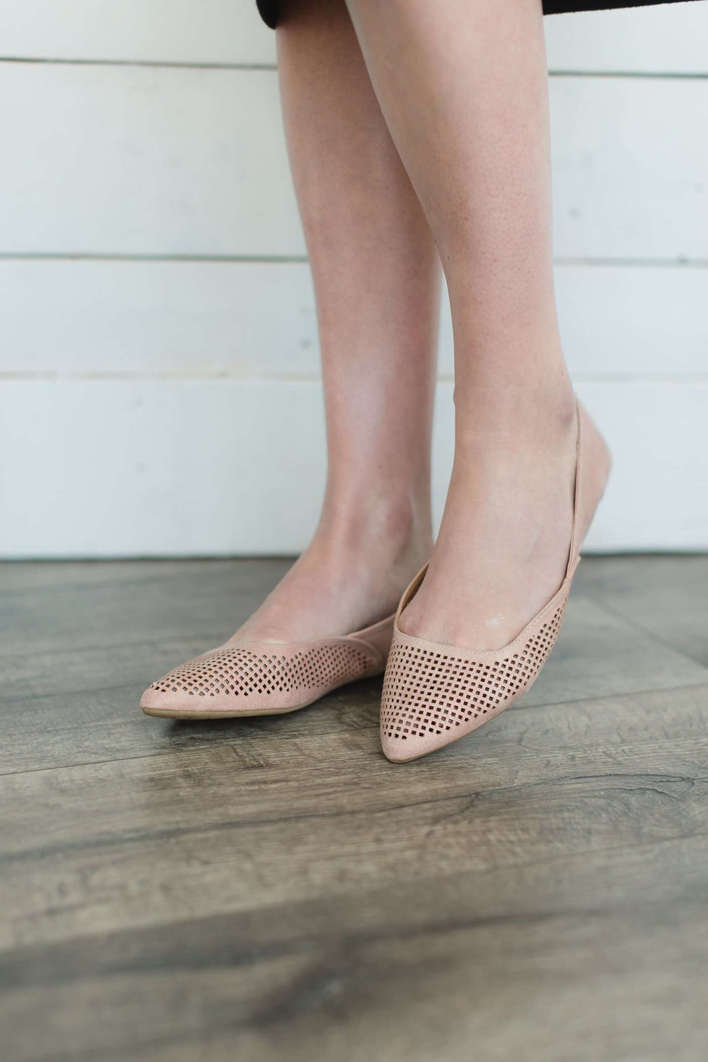 Blush or taupe casually detailed and patterned flat shoe with pointed toe.