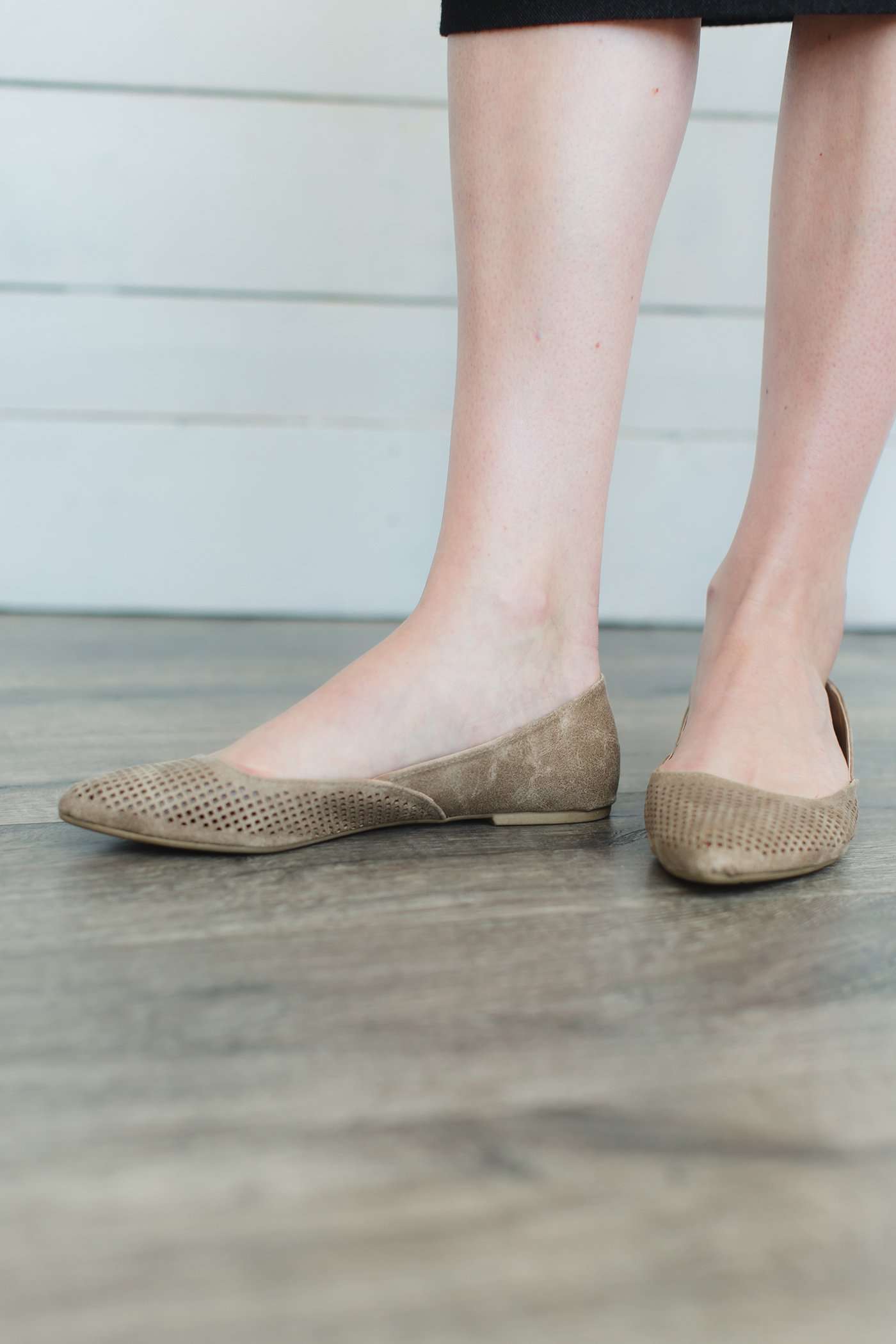 Blush or taupe casually detailed and patterned flat shoe with pointed toe.
