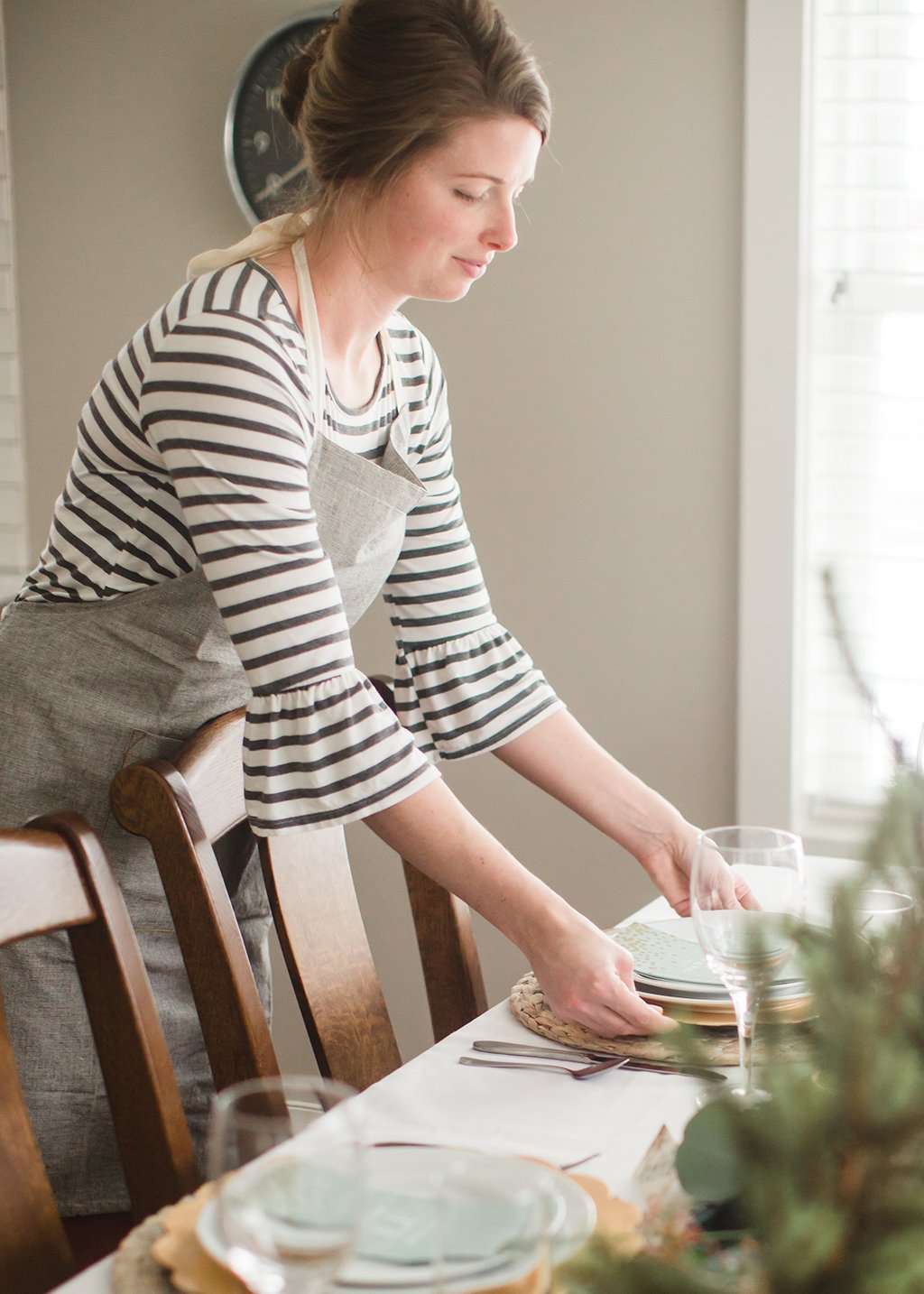 Chambray cooking apron with mustard sticking and cream neck and waist ties