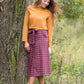 Burgandy with ivory stripe checkers on this below the knee midi skirt and buttons down the front with a back zip, detachable fabric belt and 2 front pockets.