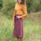 Burgandy with ivory stripe checkers on this below the knee midi skirt and buttons down the front with a back zip, detachable fabric belt and 2 front pockets.