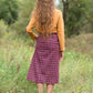 Burgandy with ivory stripe checkers on this below the knee midi skirt and buttons down the front with a back zip, detachable fabric belt and 2 front pockets.