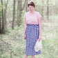 Black and white checkered below the knee skirt with elastic ruffle waistband.