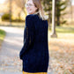Young girl wearing a navy long chenille sweater with front pockets and a cozy fit