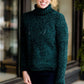 Woman wearing a dark green chenille turtle neck paired with a modest black midi skirt standing outside of Inherit Clothing Company