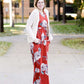 Young woman wearing a ivory chunky knit acrylic and wool sweater. This sweater has front pockets and features an open front.