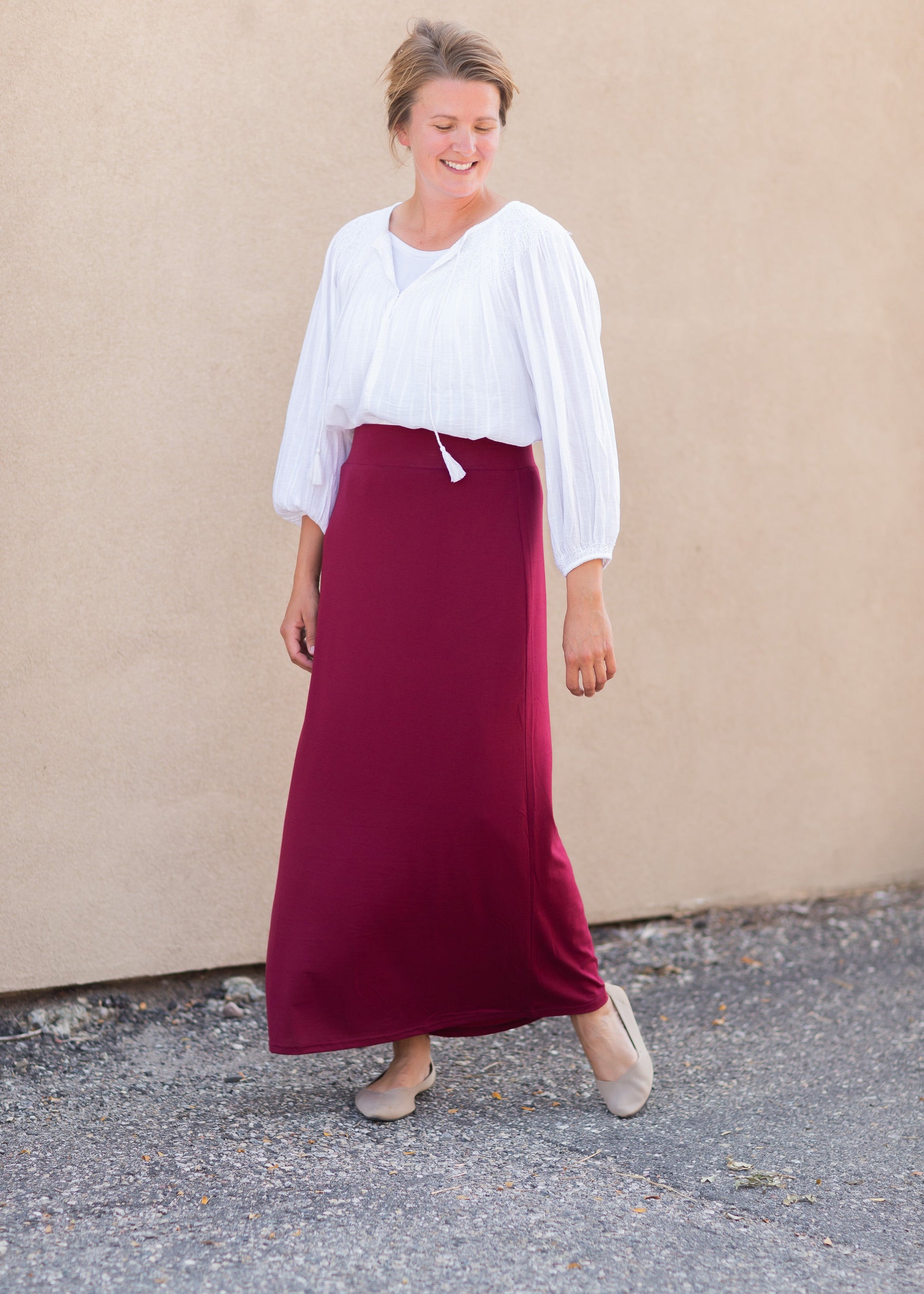 Clarise Burgundy Premium Knit Maxi Skirt is and inherit design that is a maxi knit skirt and is fully lined.