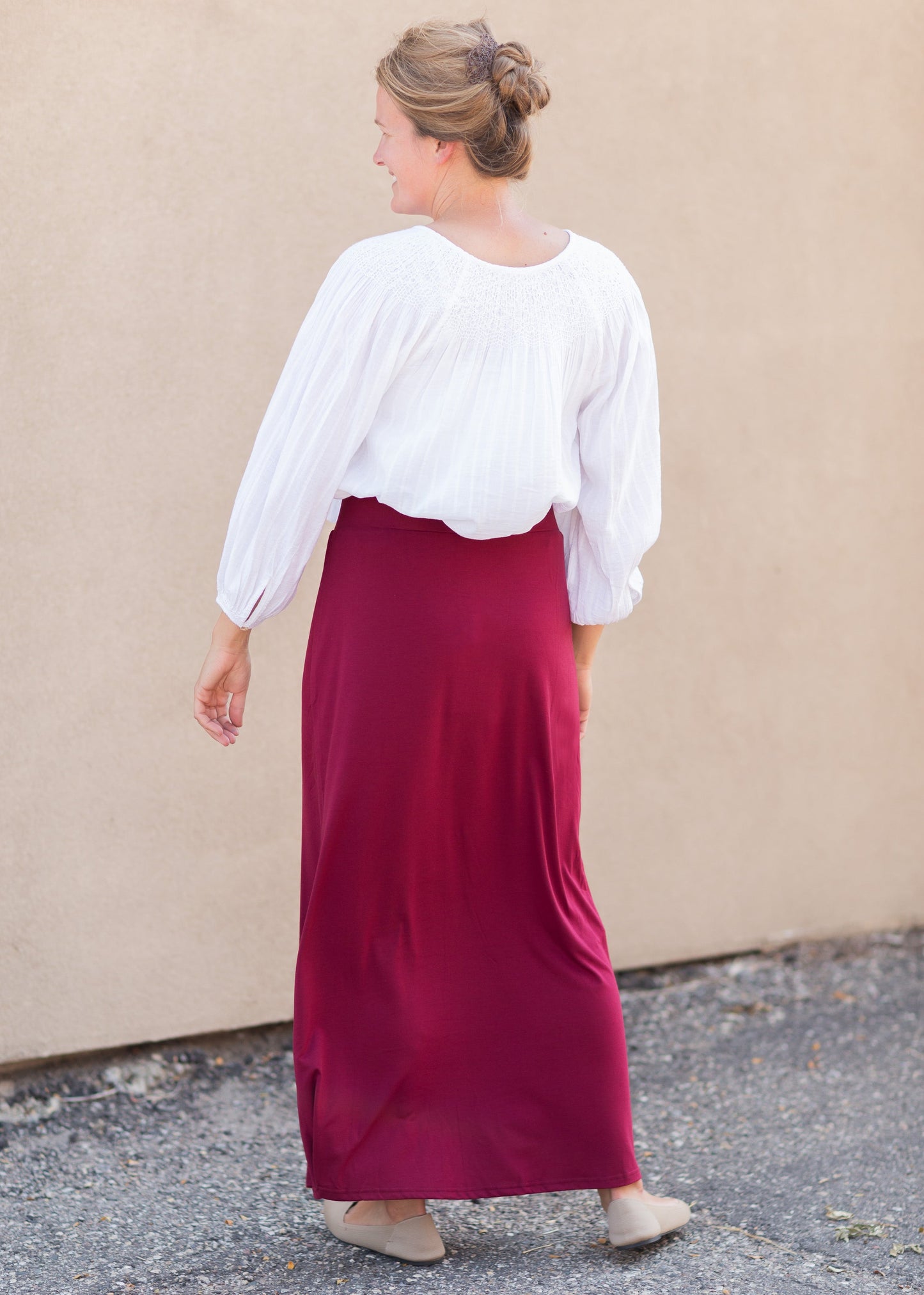 Clarise Burgundy Premium Knit Maxi Skirt is and inherit design that is a maxi knit skirt and is fully lined.