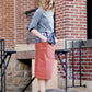 Woman wearing a classic copper colored backless genuine leather loafer