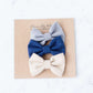 Little girls hair bow set of three. This shows a gray, taupe and navy polka dot headband or alligator clip bow.