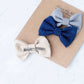 Little girls hair bow set of three. This shows a gray, taupe and navy polka dot headband or alligator clip bow.