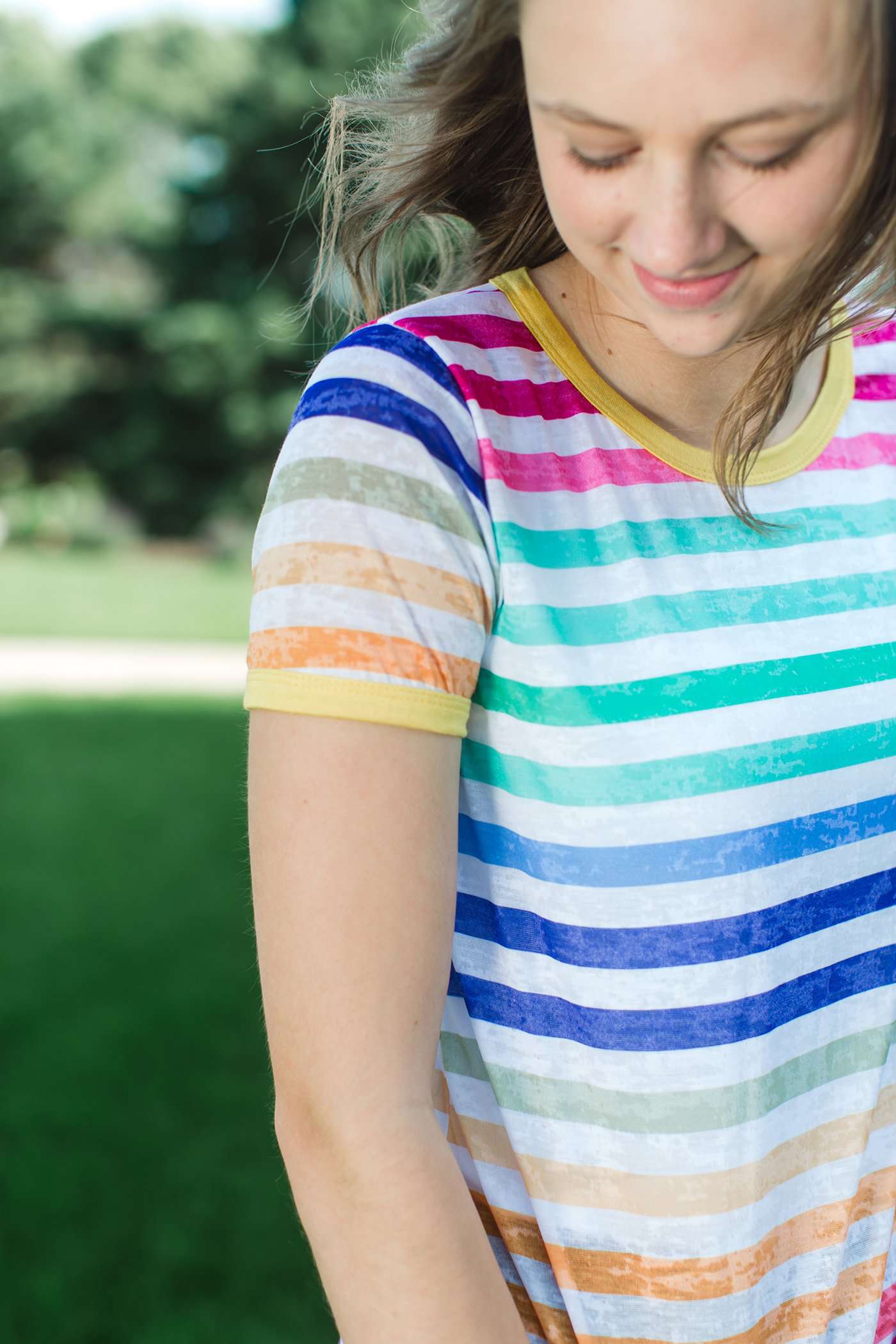 rainbow striped modest tee with white accents.