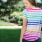 rainbow striped modest tee with white accents.